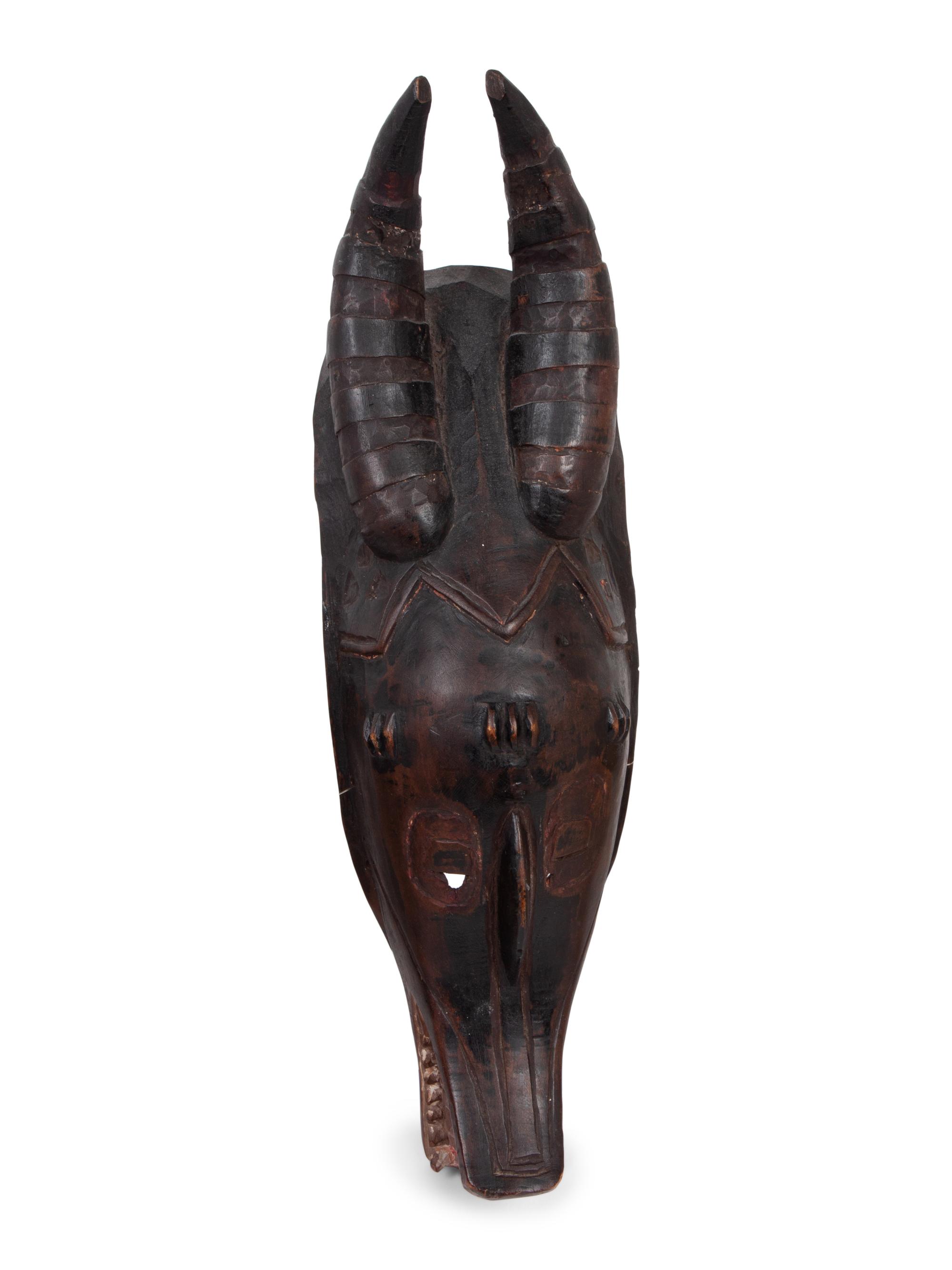 A Group of Ten Carved Ethnographic Masks
