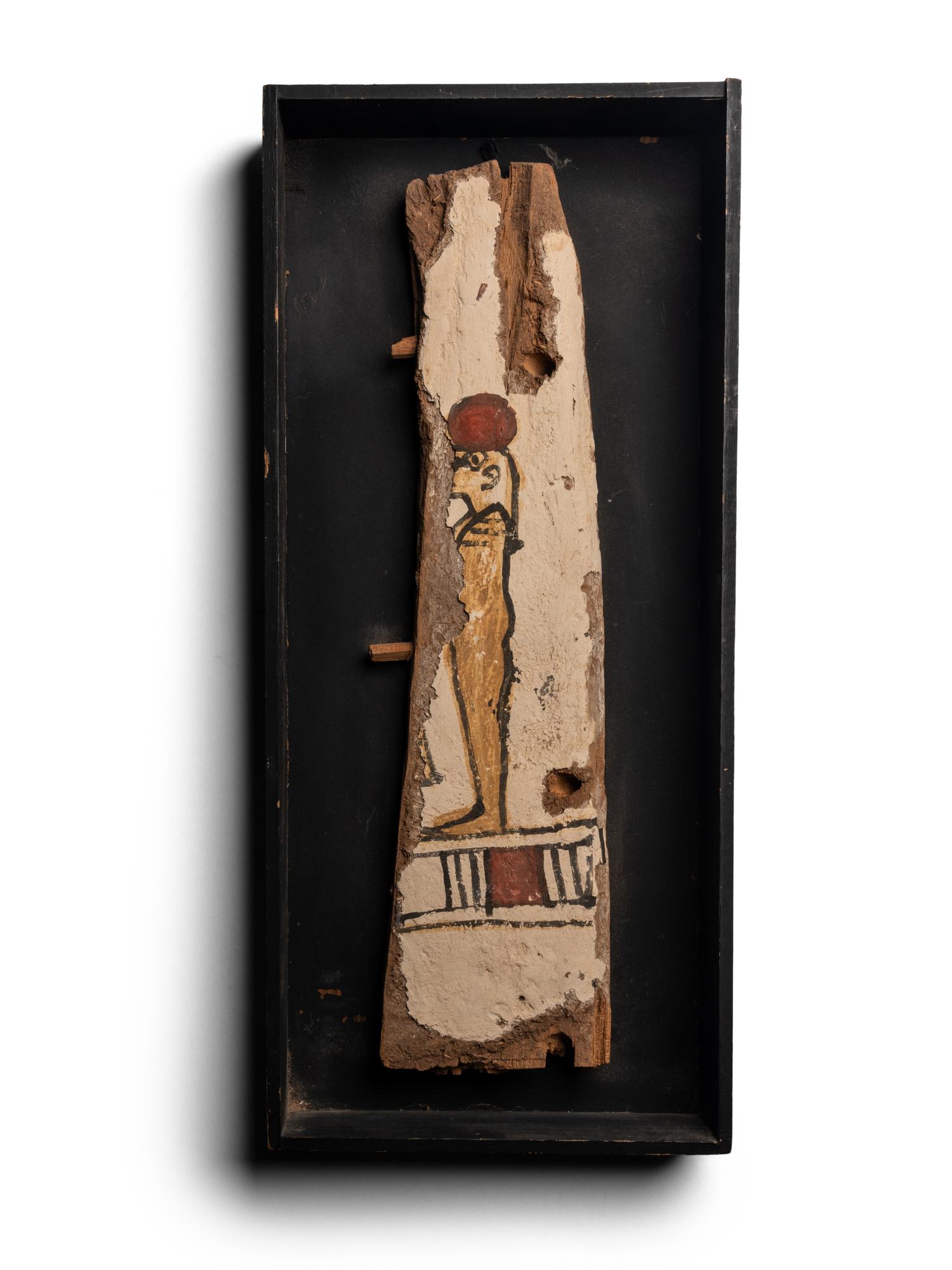 An Egyptian Painted Wood Sarcophagus Fragment