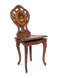 A Carved Black Forest Musical Child's Chair