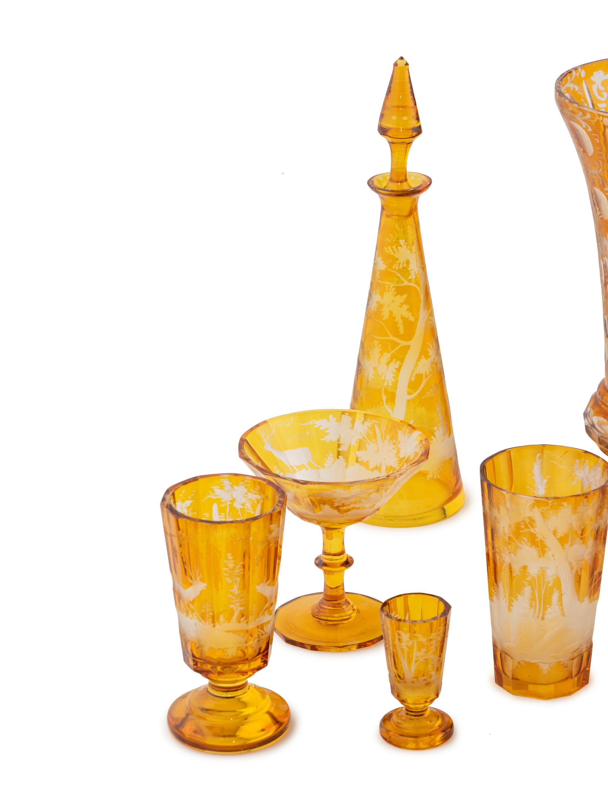 A Bohemian Amber Etched Glass Table Service