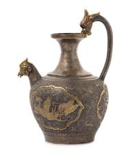 A Chinese Silver and Gilt Phoenix-Head Ewer TANG DYNASTY Height 8 1/2 x width 6 inches. — TANG DYNASTY