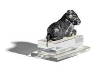 A Mesopotamian Mottled Black Stone Recumbent Bull Amulet