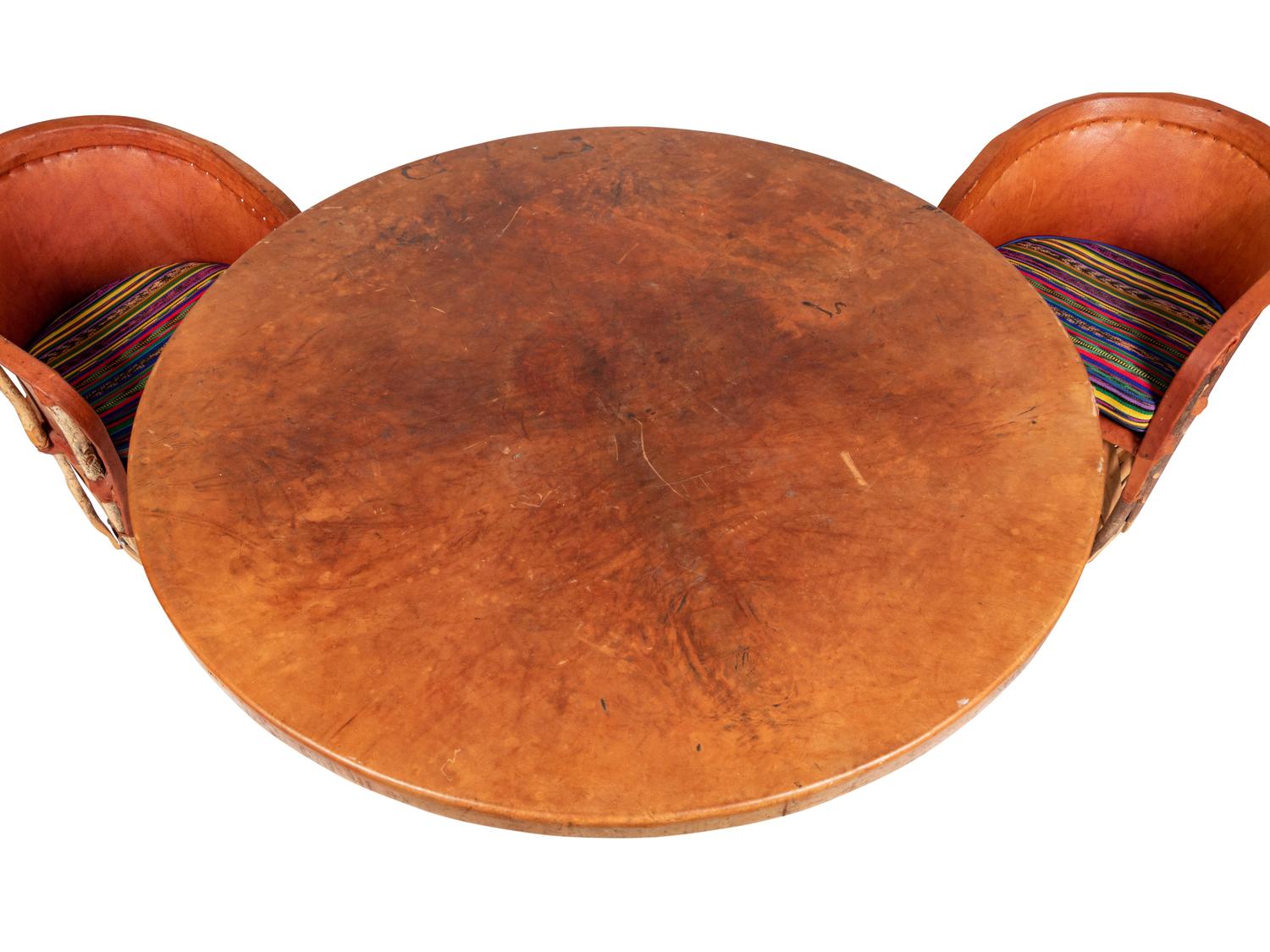 A Mexican Equipale Dining Table and Chairs