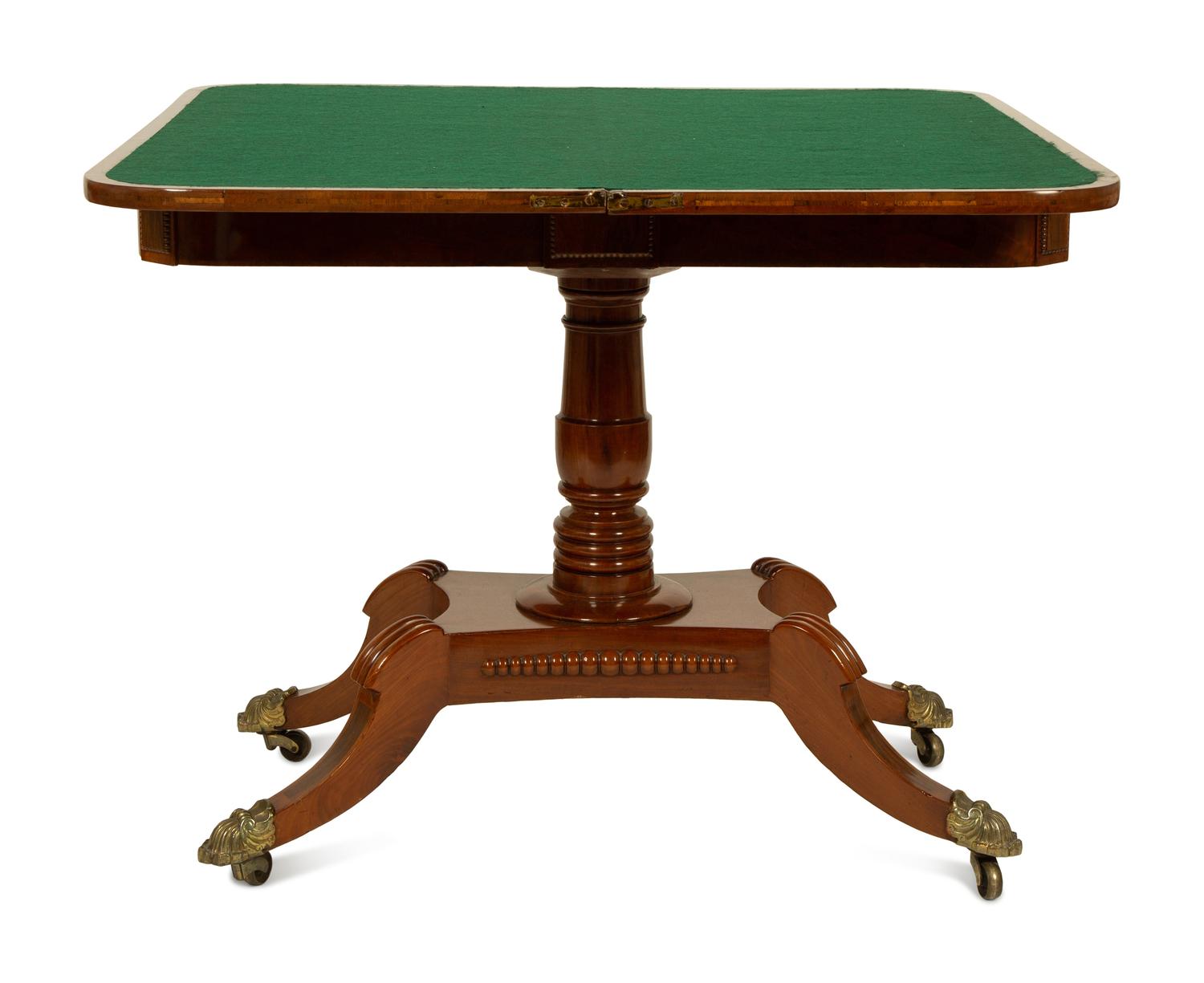 A Pair of Regency Flame Mahogany Flip-Top Games Tables — 19TH CENTURY