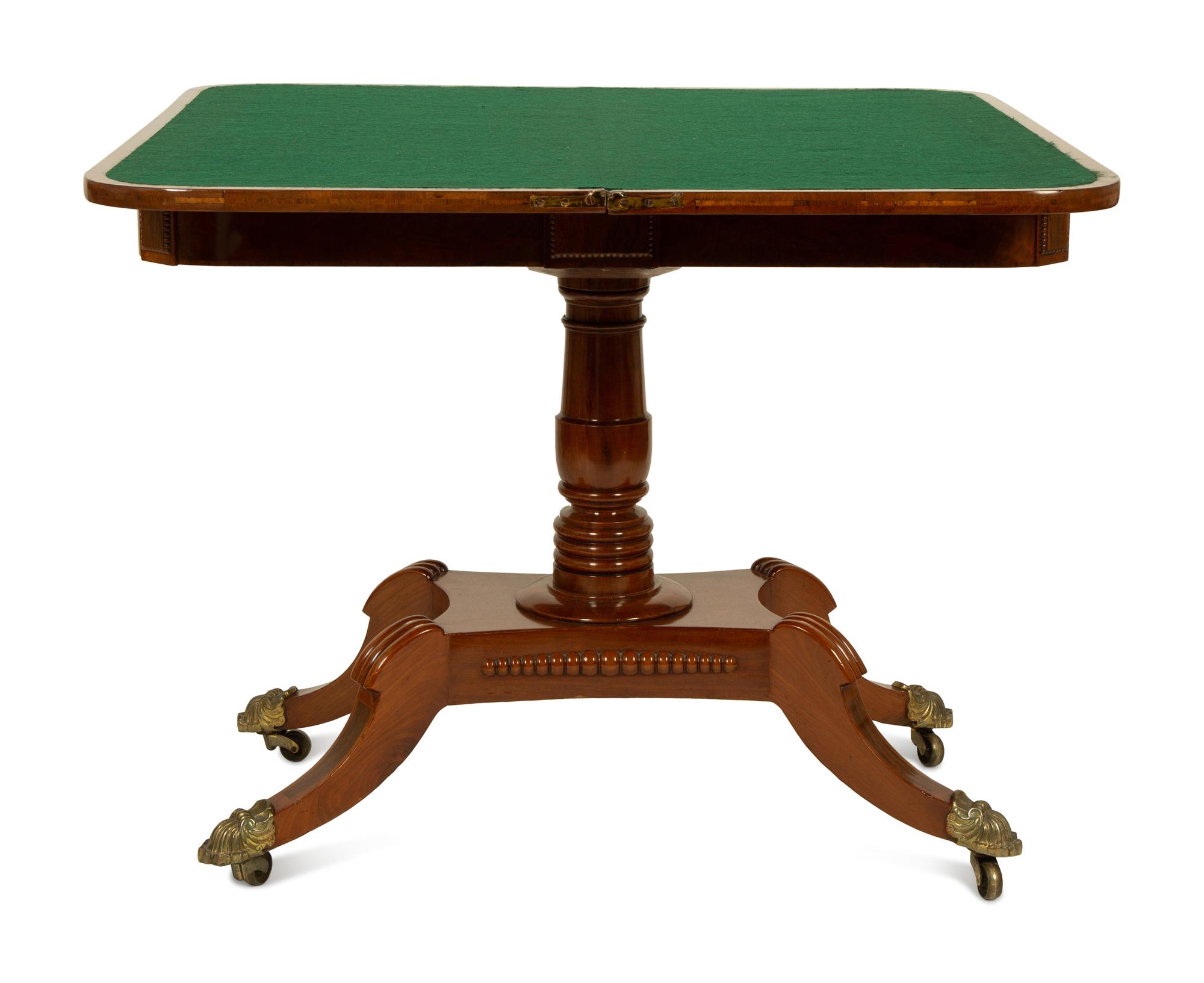 A Pair of Regency Flame Mahogany Flip-Top Games Tables — 19TH CENTURY