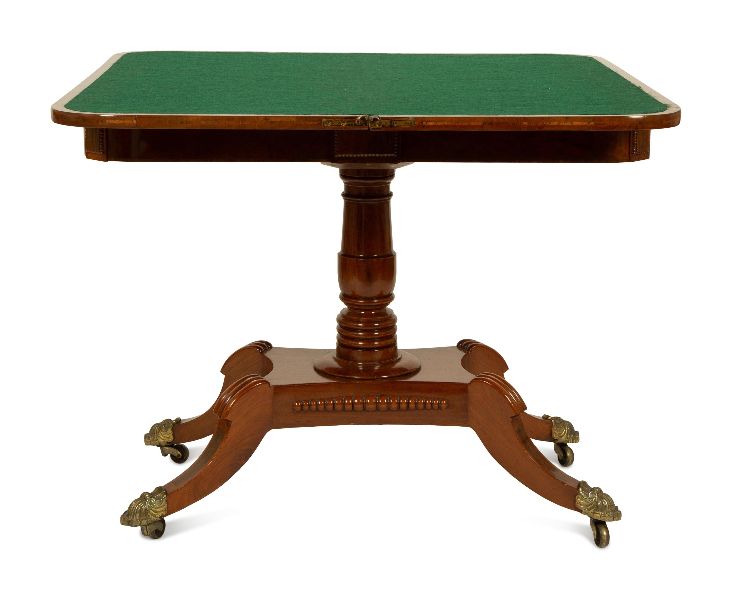 A Pair of Regency Flame Mahogany Flip-Top Games Tables — 19TH CENTURY