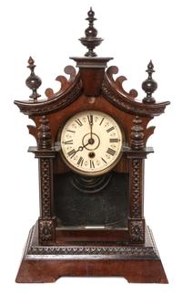A Victorian Walnut Bracket Clock Height 18 3/4 inches.