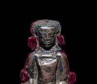 A Thai Silvered Metal Repoussé Plaque of Buddha