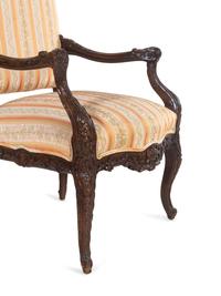 A Régence Style Carved Walnut Fauteuil