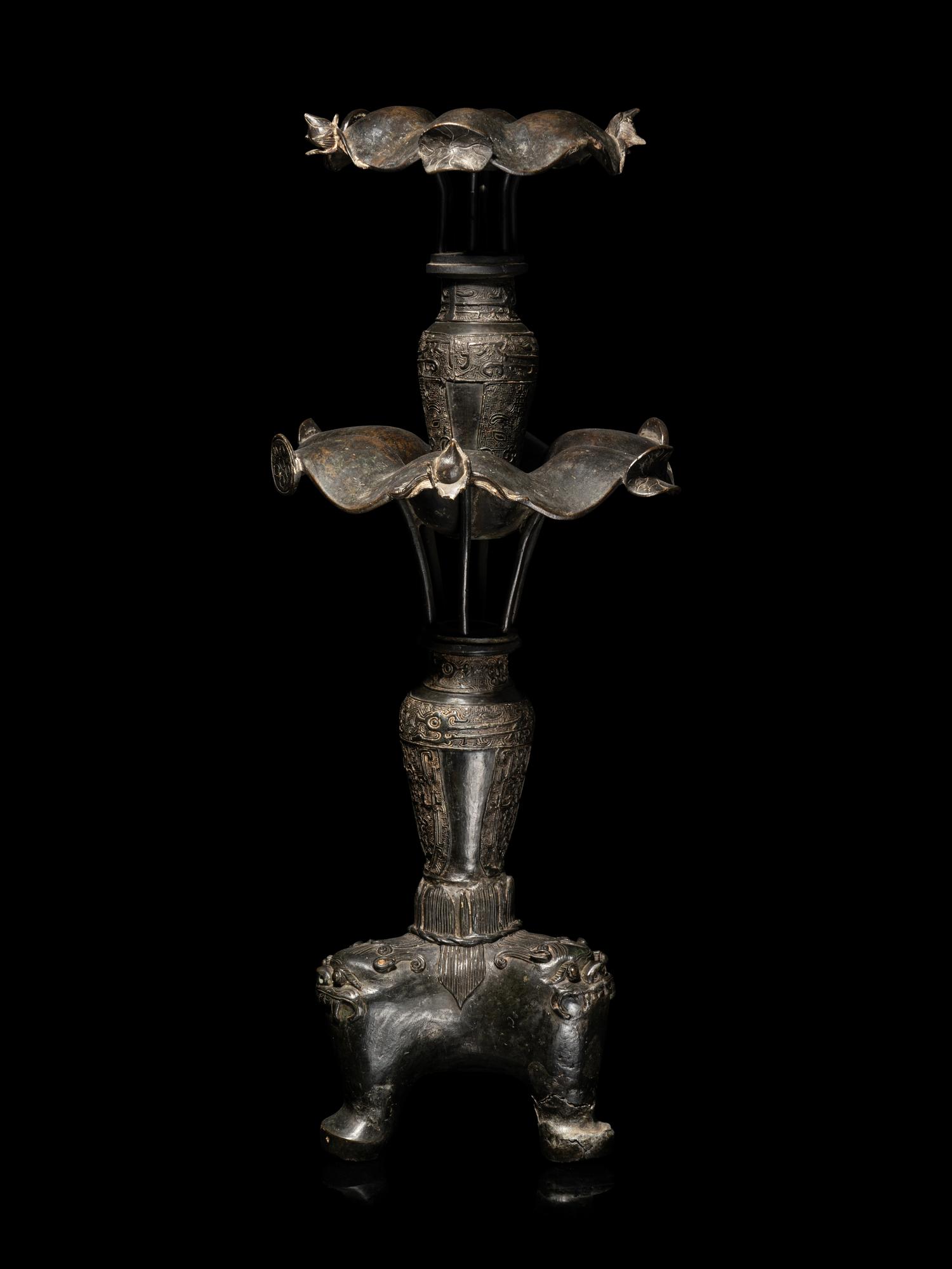 A Large Pair of Bronze Candle Holders