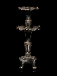 A Large Pair of Bronze Candle Holders