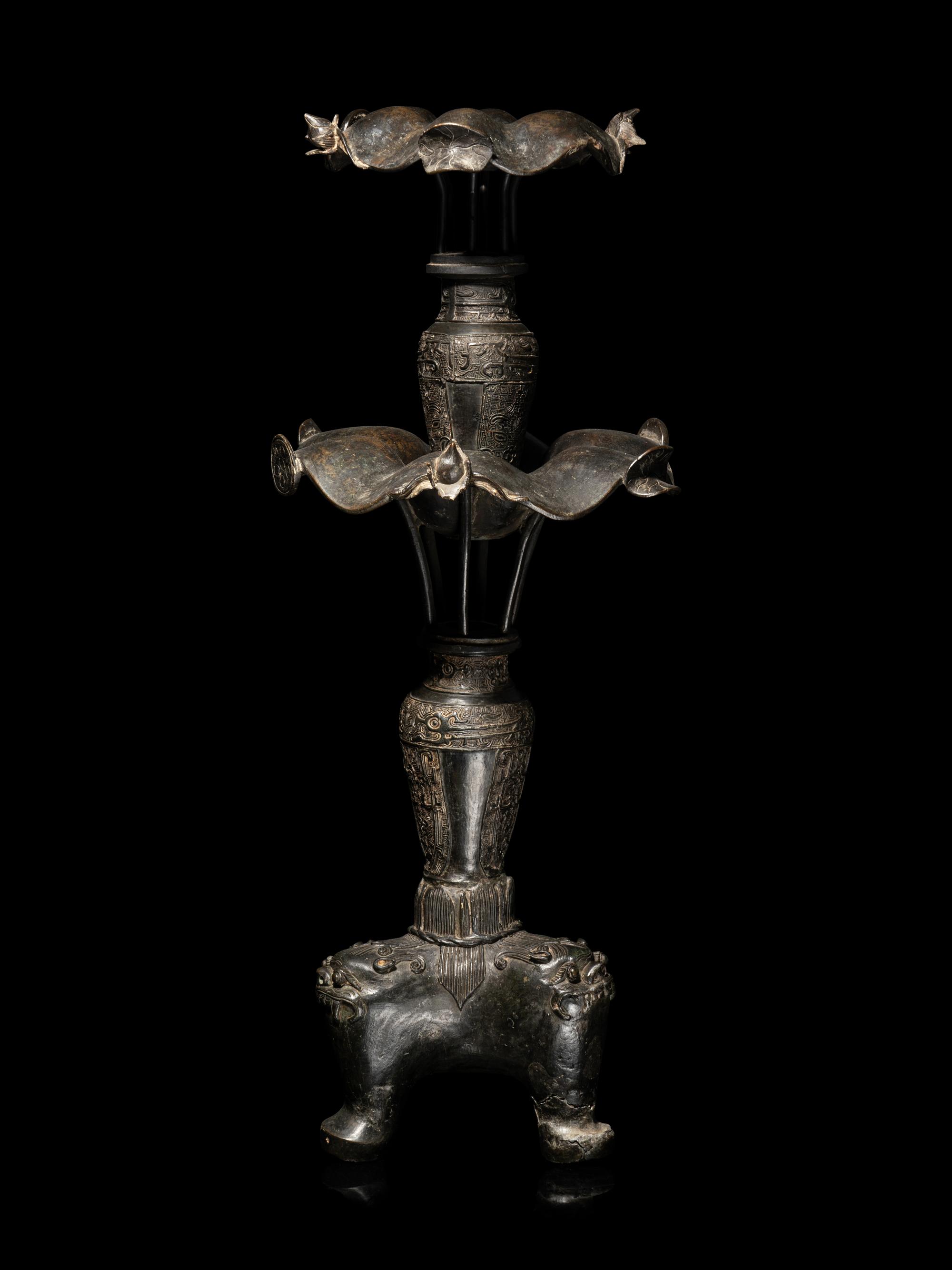 A Large Pair of Bronze Candle Holders