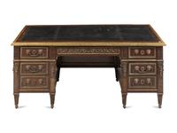 A Louis XVI Style Gilt Metal Mounted Mahogany Pedestal Desk