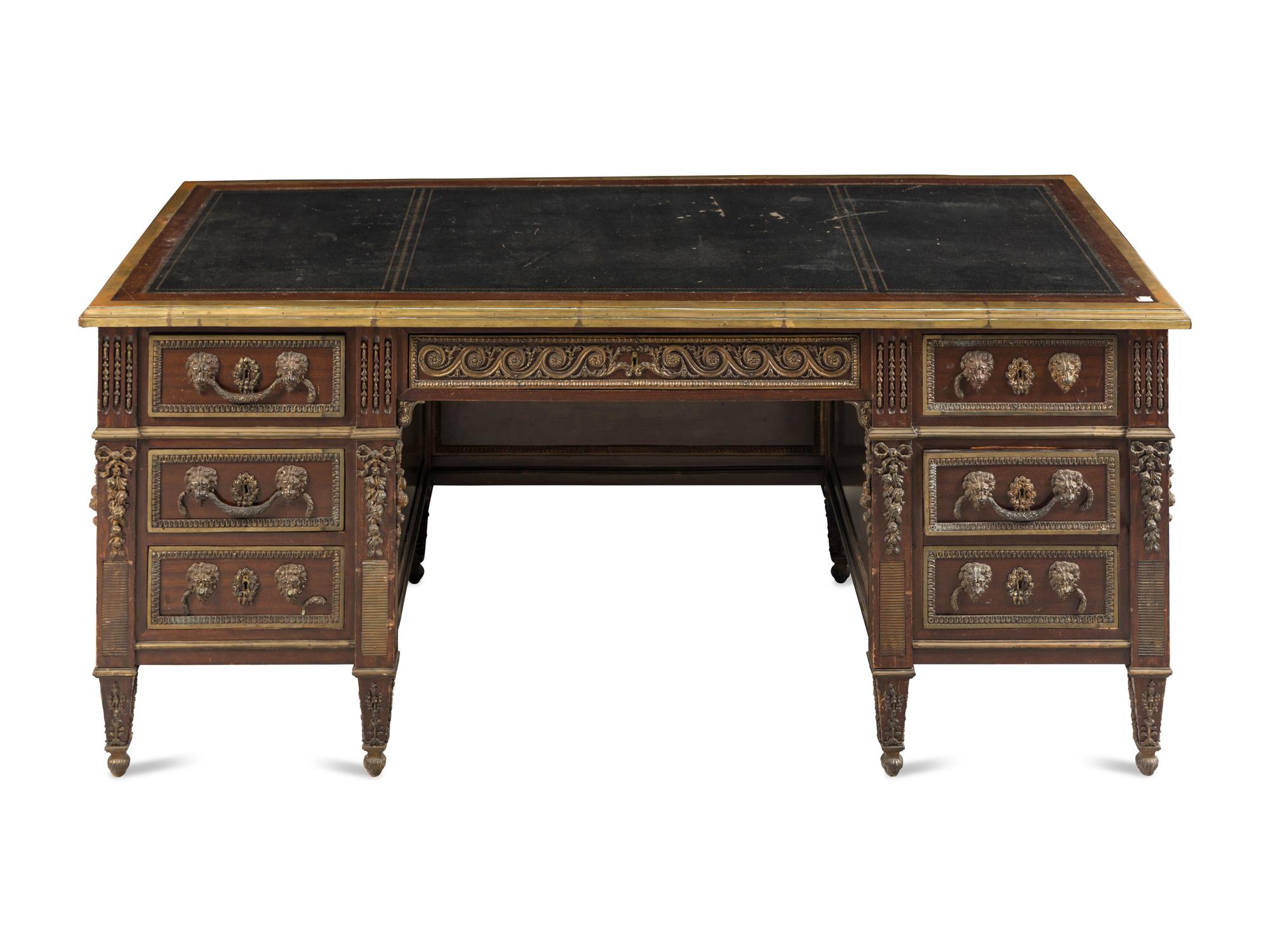 A Louis XVI Style Gilt Metal Mounted Mahogany Pedestal Desk