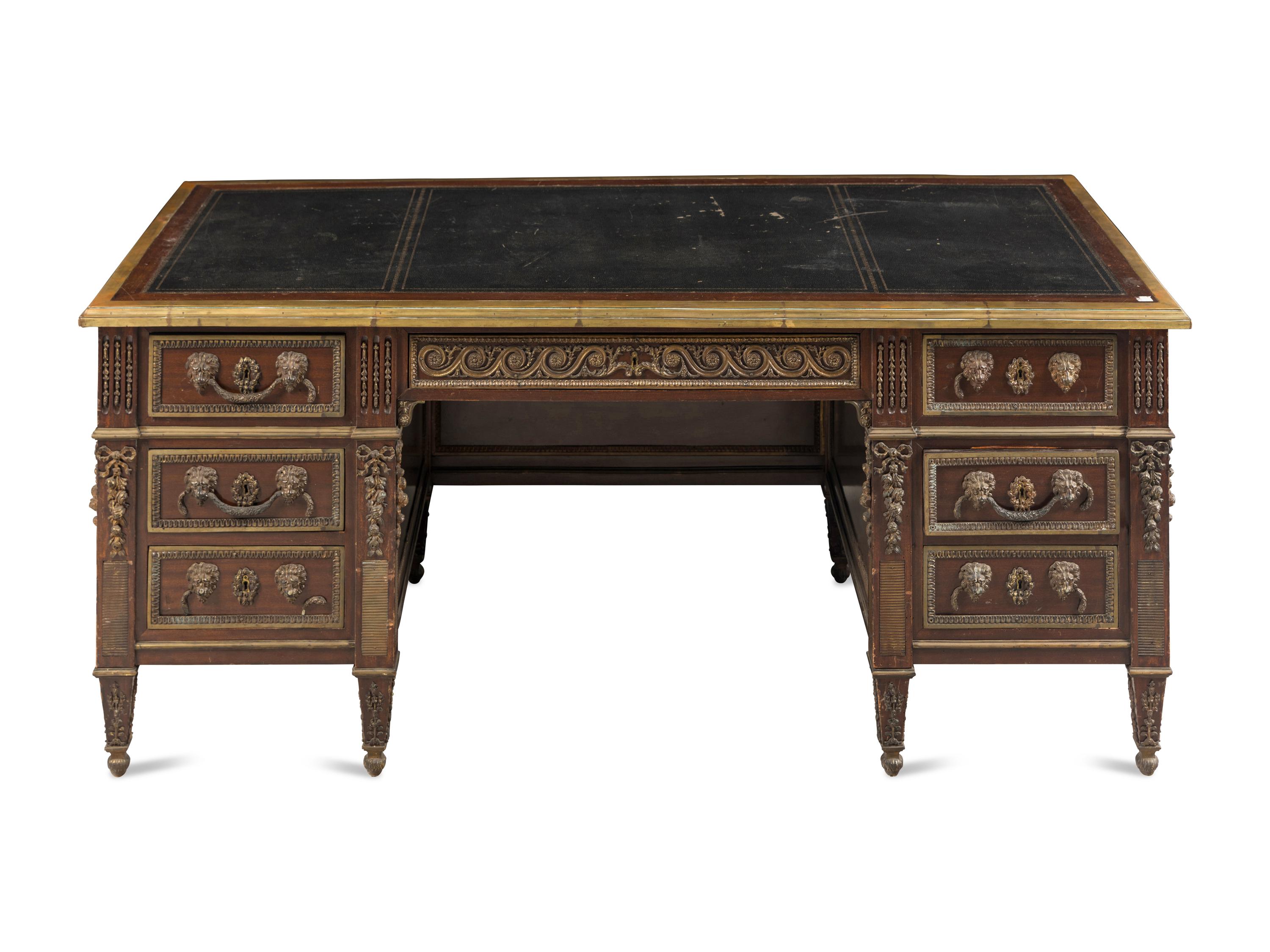 A Louis XVI Style Gilt Metal Mounted Mahogany Pedestal Desk