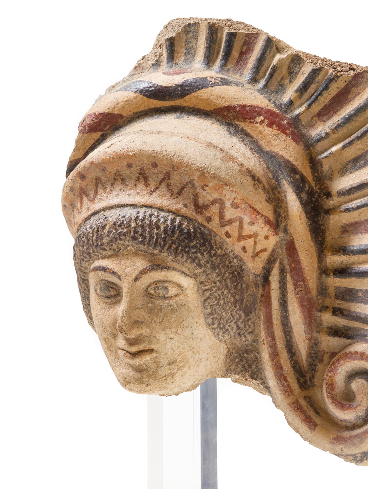 An Etruscan Terra Cotta Antefix Length 10 1/8 inches. — CIRCA EARLY 5TH CENTURY B.C.E.