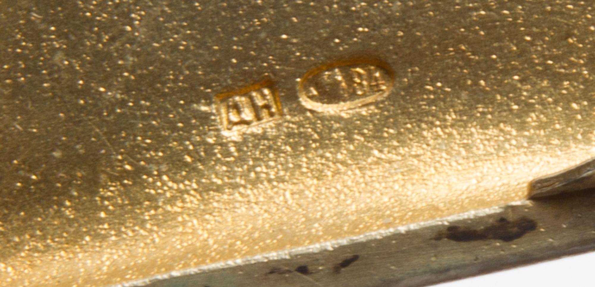 A Russian Enameled Silver Cigarette Case, Mark of D.P. Nikitin, Moscow, late 19th century, the lid with an enameled cartouche depicting