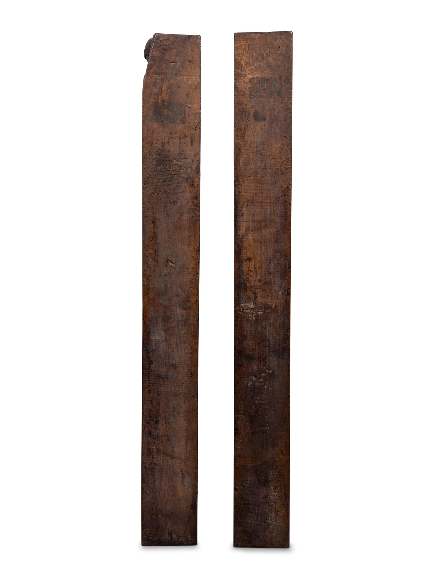 A Pair of Continental Carved Figural Pilasters