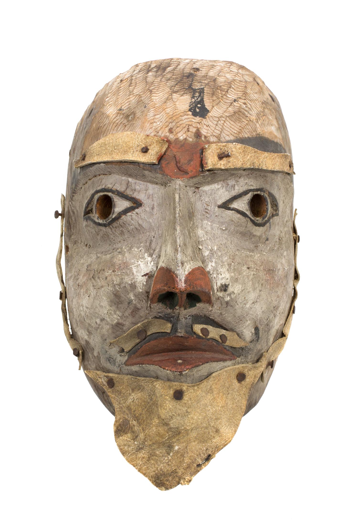 A Kwakwaka'wakw Painted Wood Mask Length 11 1/2 x width 7 x depth 5 1/2 inches.