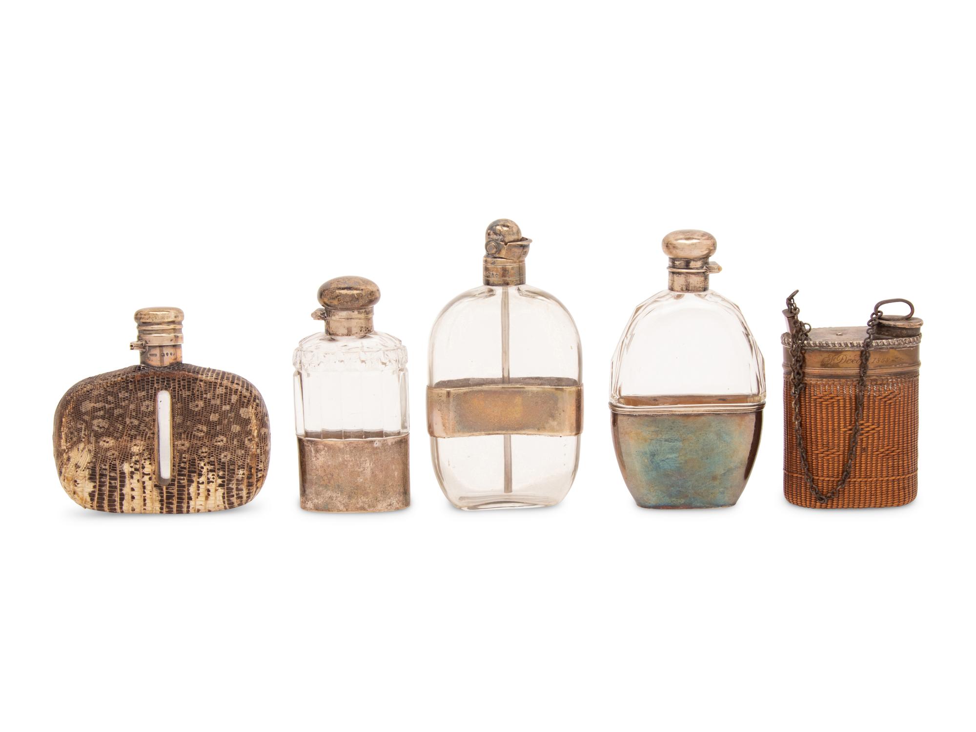 A Group of Five Silver, Reed and Snakeskin Mounted Flasks