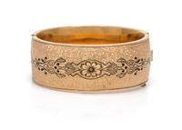 A Gold Filled and Black Enamel Bangle, 24.20 dwts.