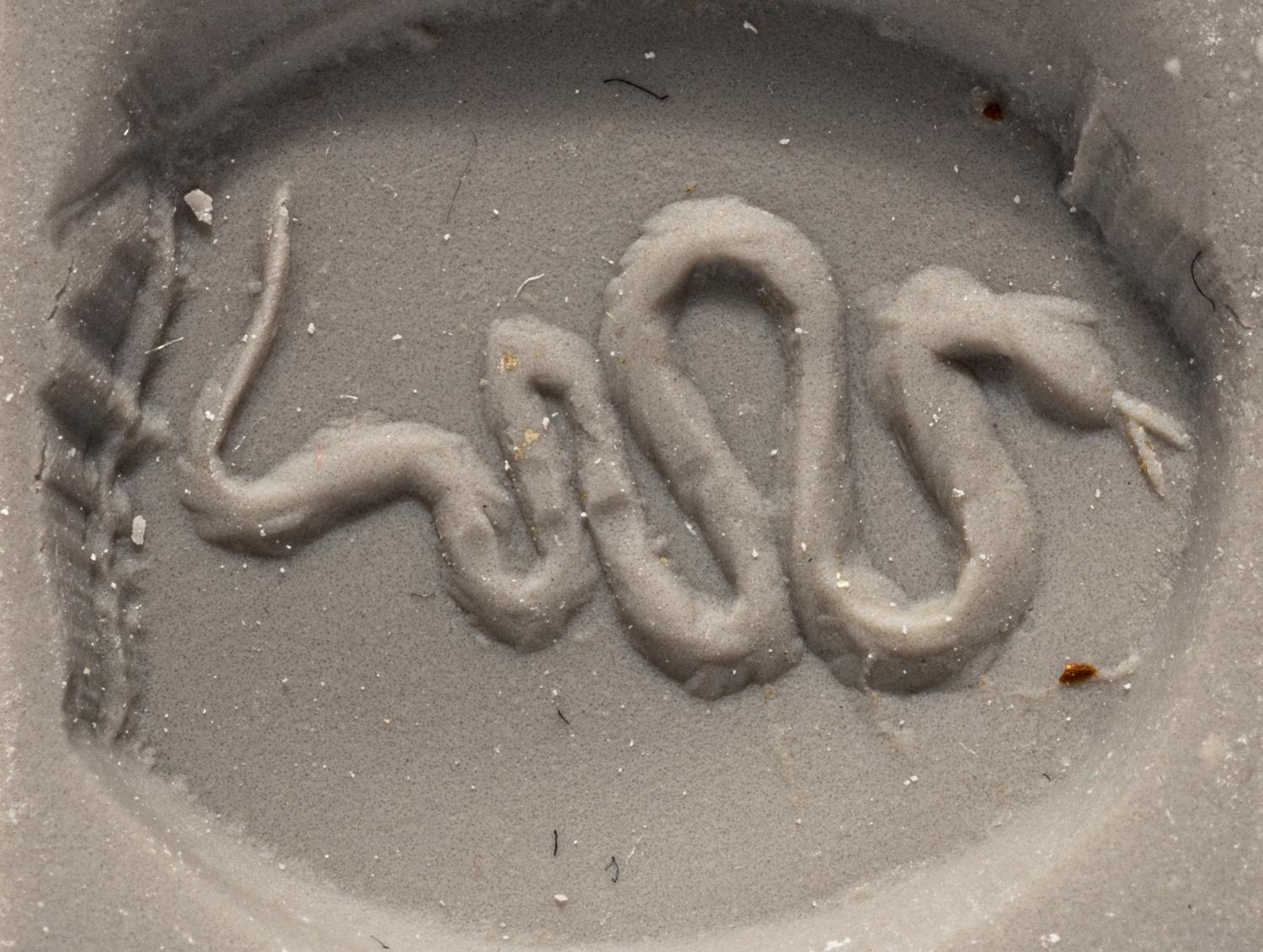 A Greek Quartz Scaraboid with a Snake