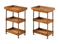 A Pair of Continental Walnut Three-Tier Side Tables