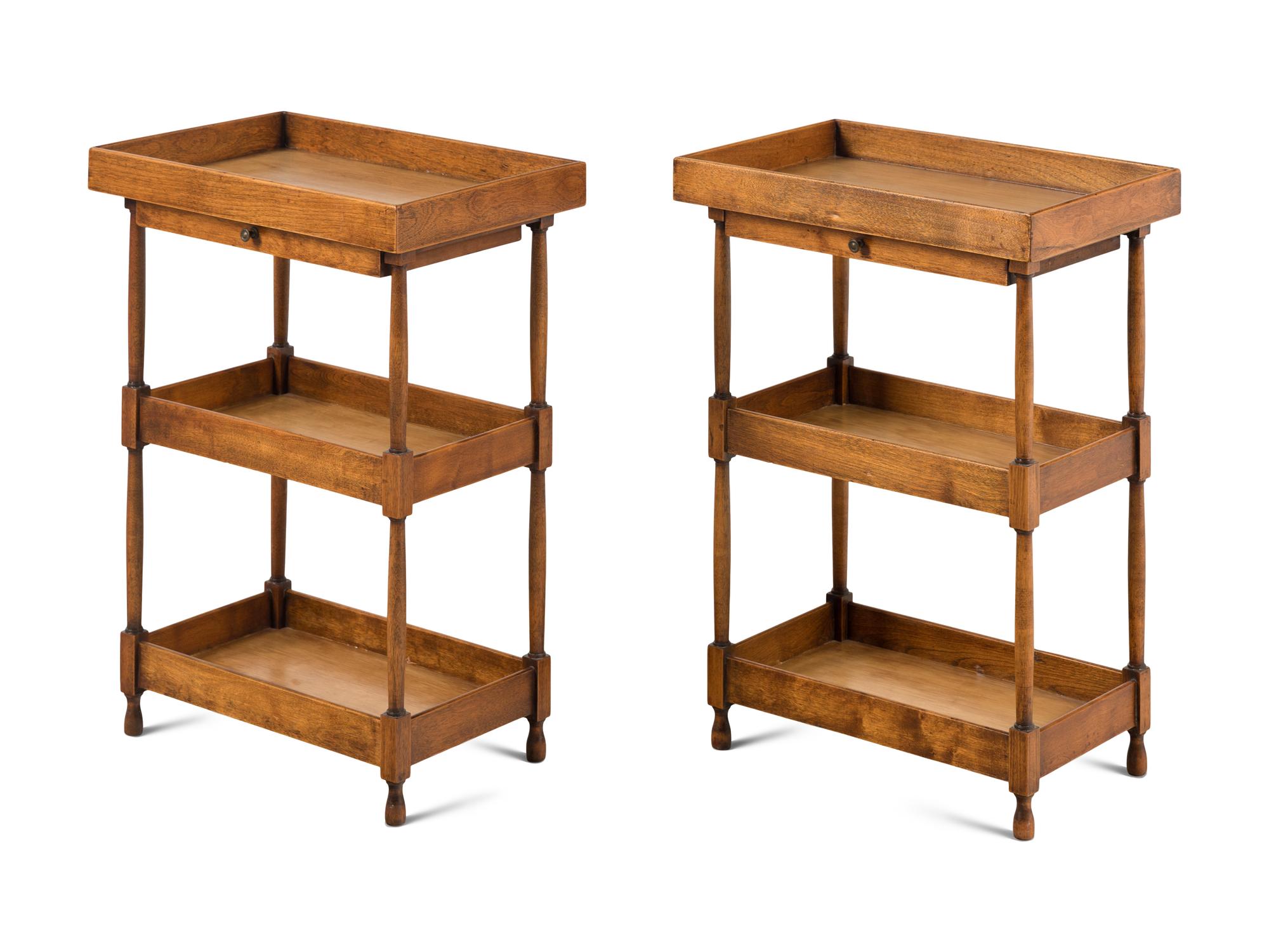 A Pair of Continental Walnut Three-Tier Side Tables