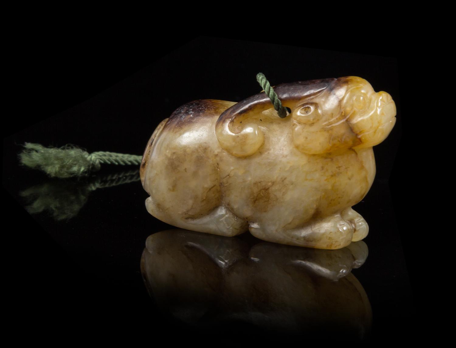 A Carved Jade Toggle Length 2 3/8 inches.
