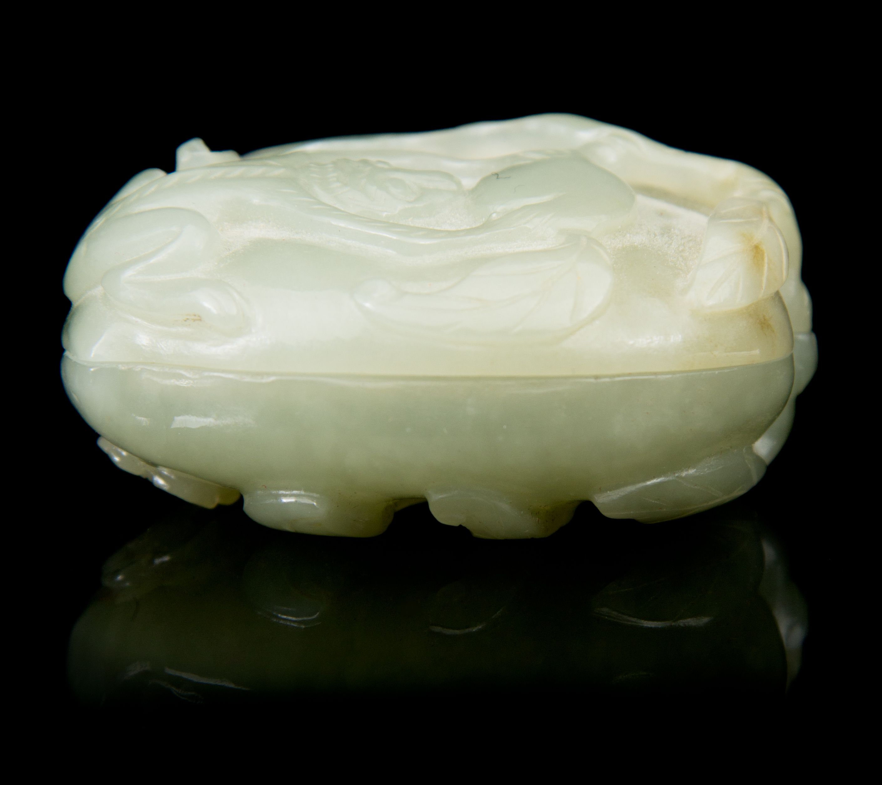 A Carved Jade Box and Cover Length 2 3/8 inches. | Freeman's