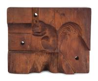 A Two-Part Carved Pine Squirrel Form Butter Mold