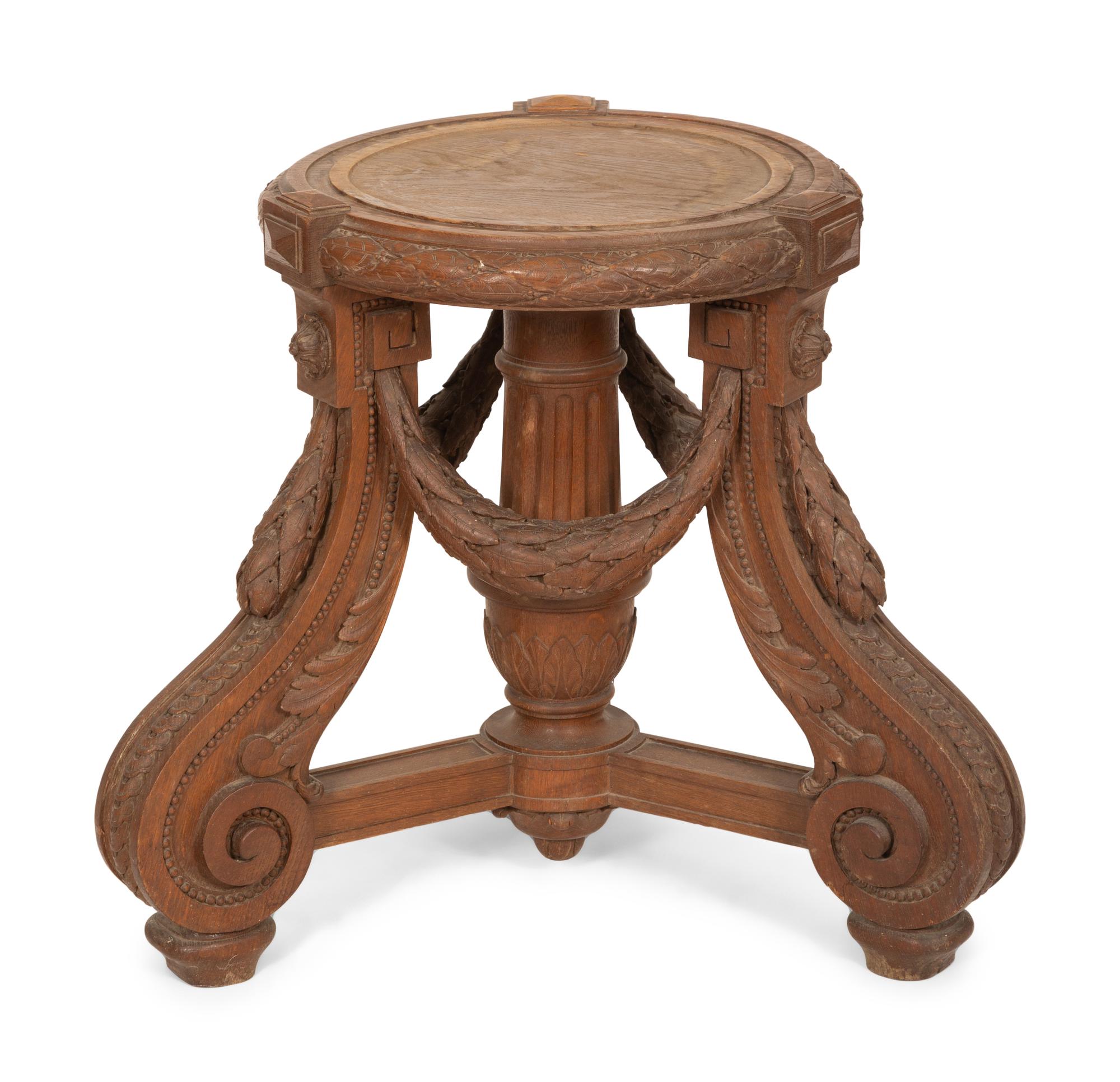 An Italian Carved Walnut Tripod Pedestal Table