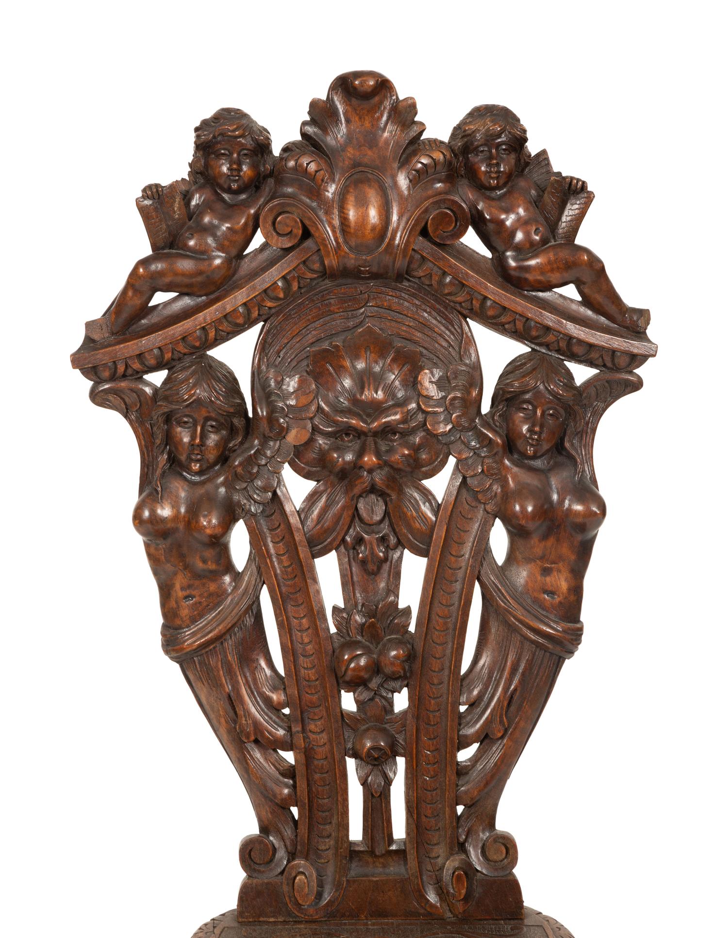 An Italian Renaissance Revival Carved Walnut Sgabello Hall Chair