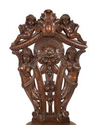 An Italian Renaissance Revival Carved Walnut Sgabello Hall Chair