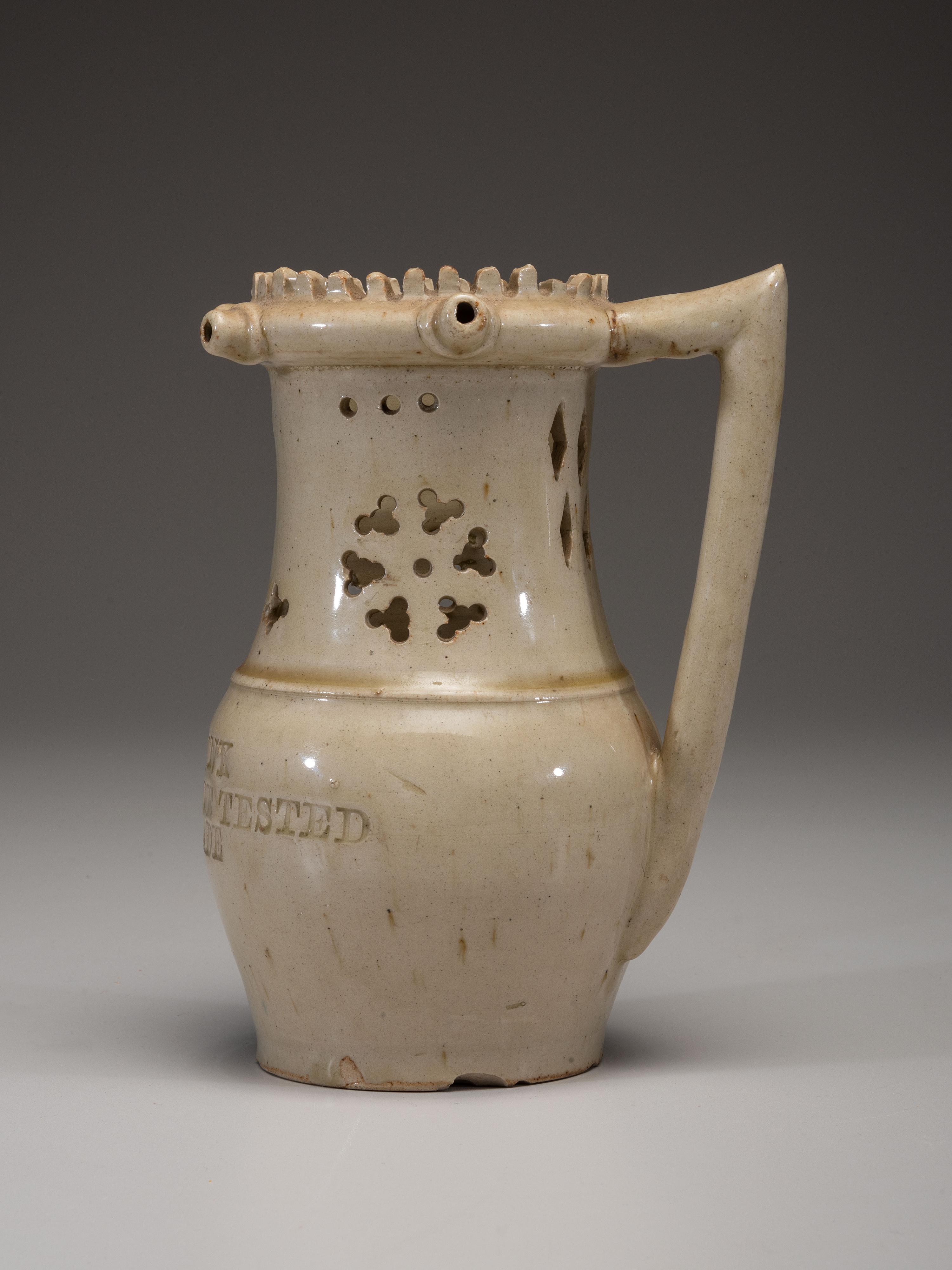 An Incised and Impressed Stoneware Puzzle Jug