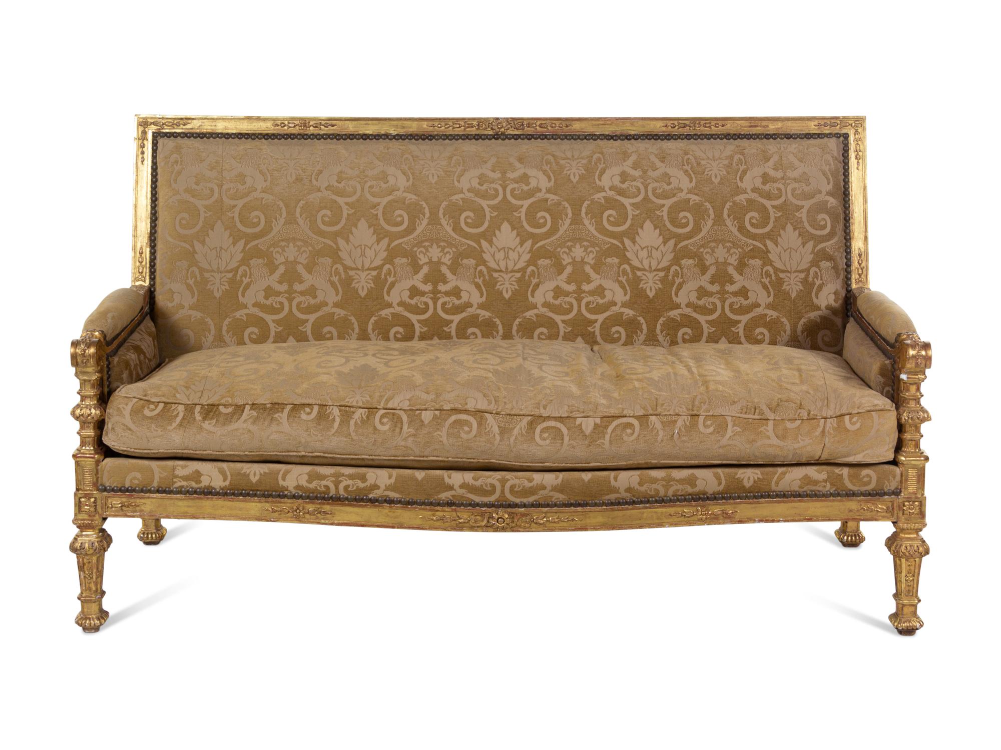 A Pair of Régence Style Carved Giltwood Sofas
