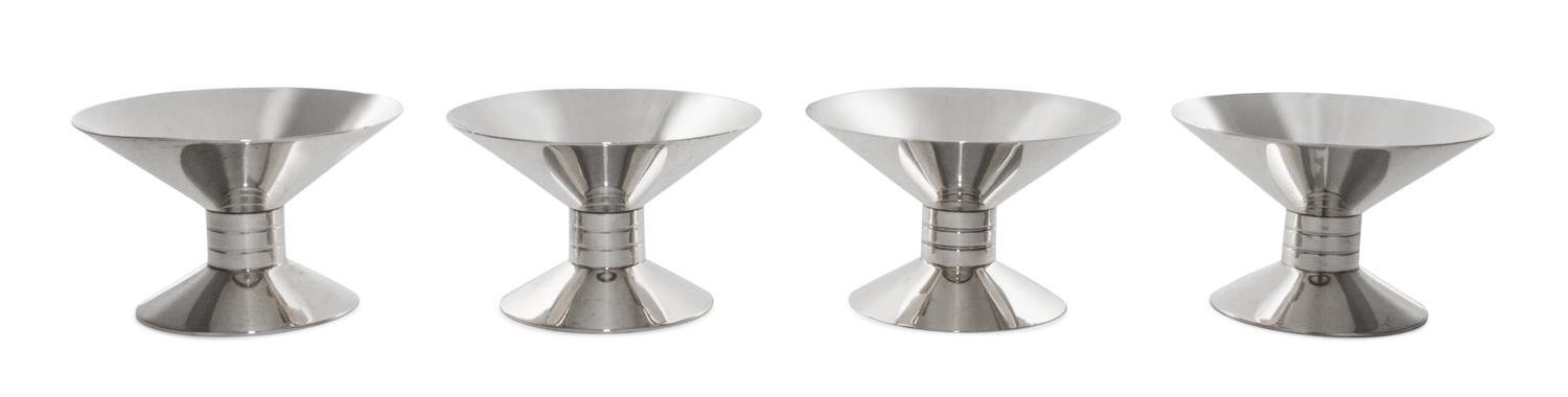 A Set of Four American Silver Candlesticks, Tiffany & Co., New York, NY, 1939-1940, each of waisted form, rising from a spreading circu
