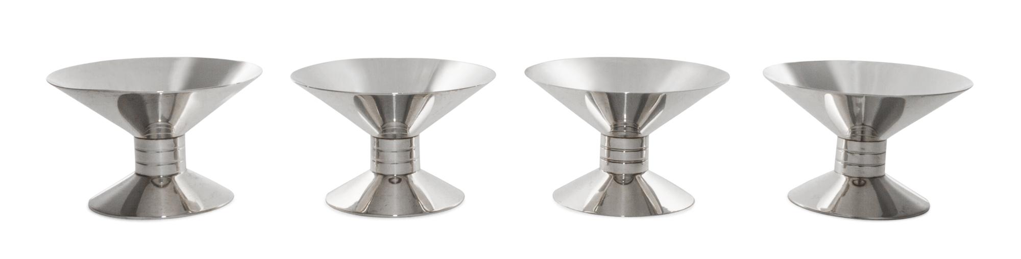 A Set of Four American Silver Candlesticks, Tiffany & Co., New York, NY, 1939-1940, each of waisted form, rising from a spreading circu