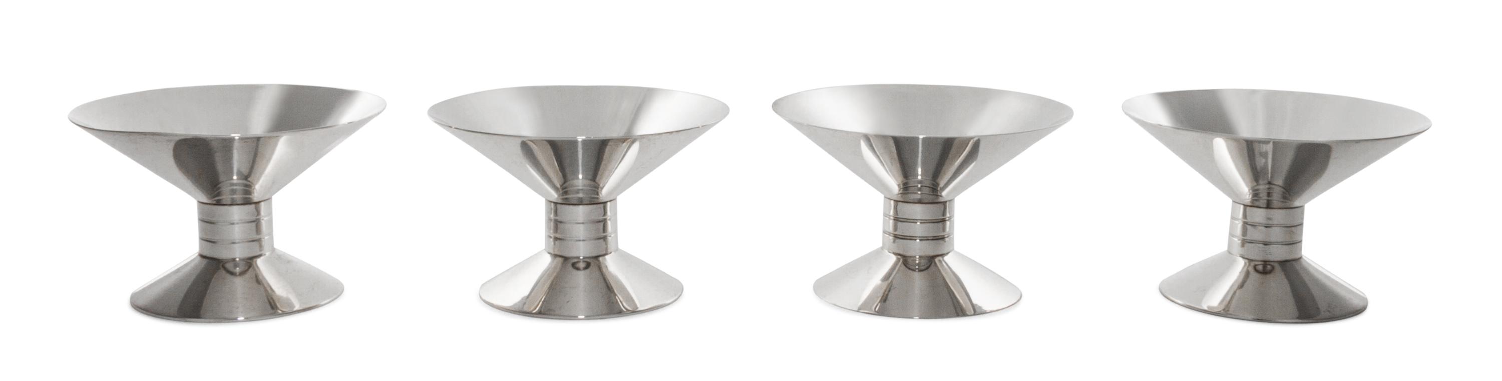 A Set of Four American Silver Candlesticks, Tiffany & Co., New York, NY, 1939-1940, each of waisted form, rising from a spreading circu