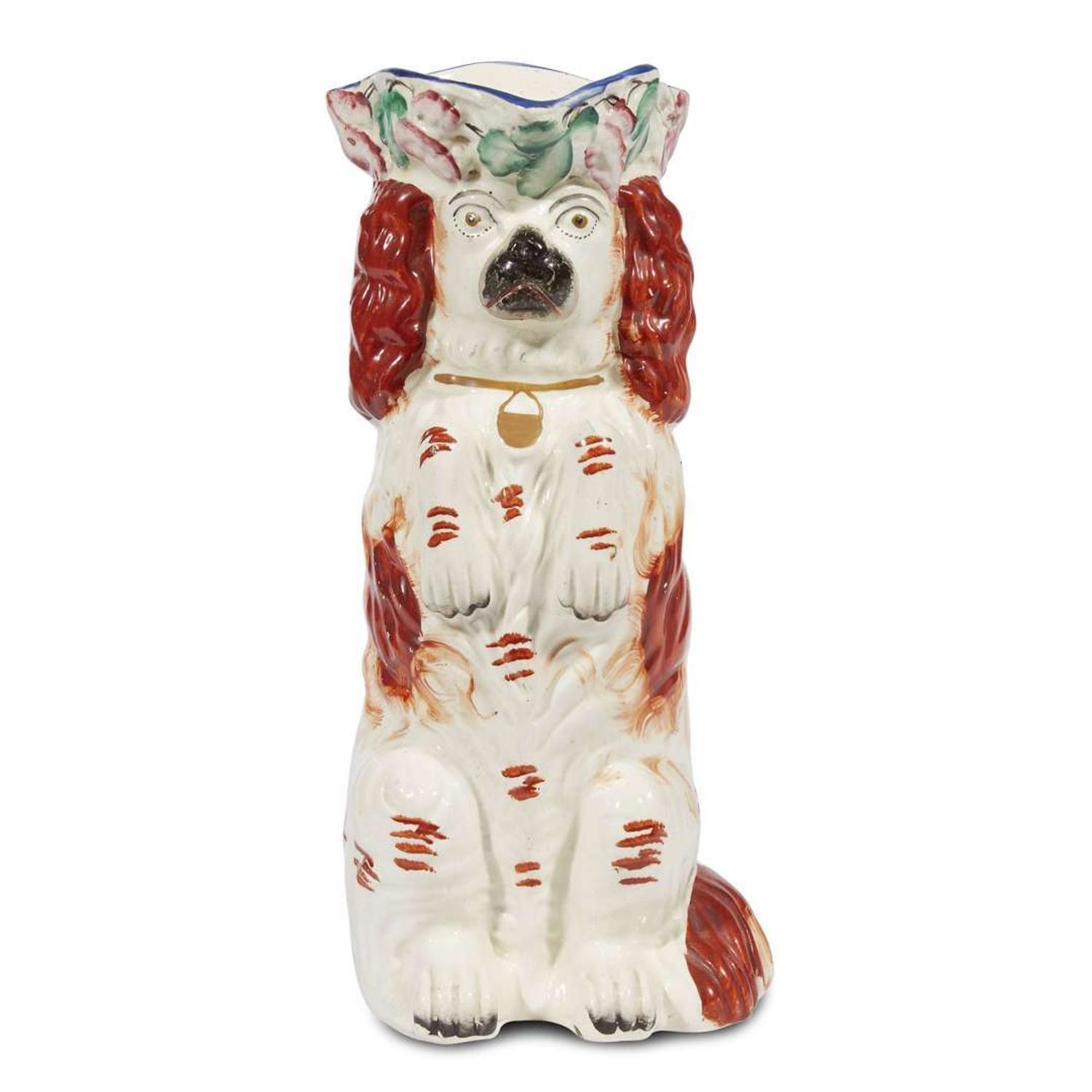 A large collection of seated Staffordshire dog figures 19th/20th centuries