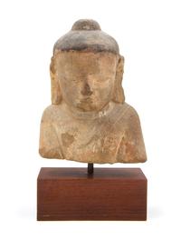 A Southeast Asian Sandstone Head of Buddha Approximate height 9 inches.