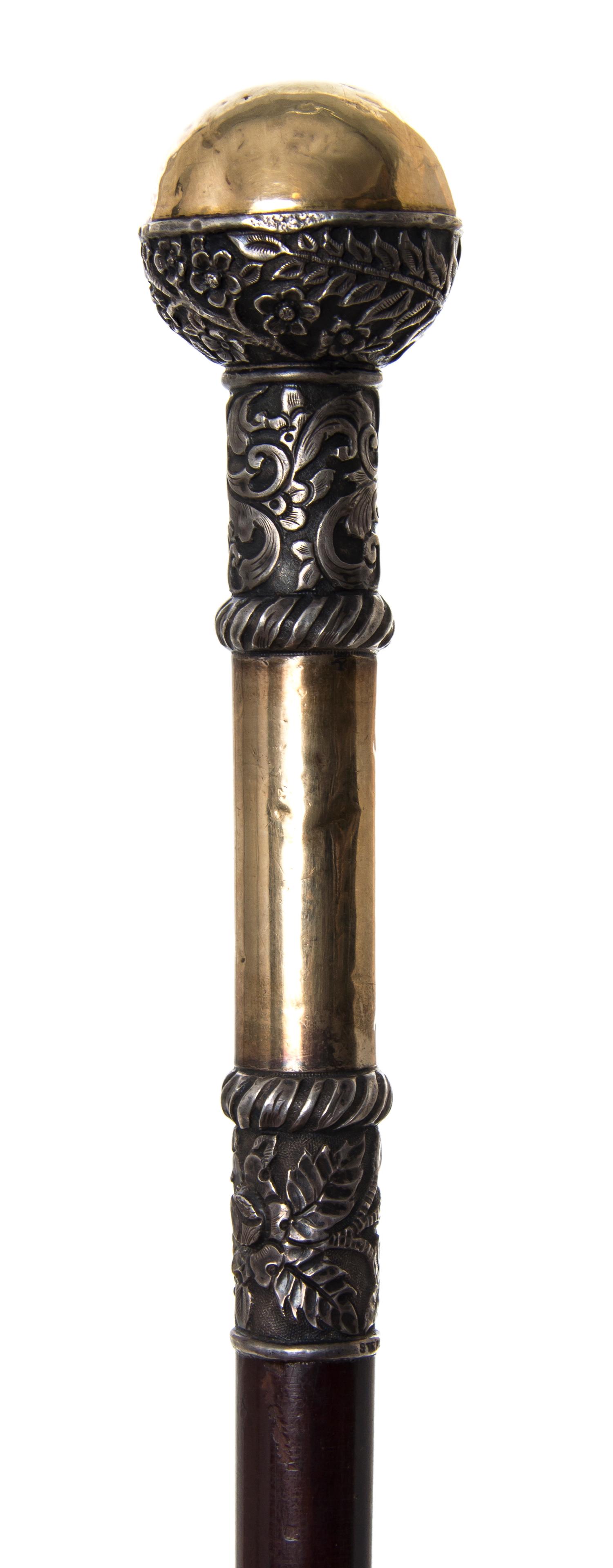 An American Sterling Silver Handled Walking Stick, Diameter of handle 1 1/2 x length overall 38 inches.
