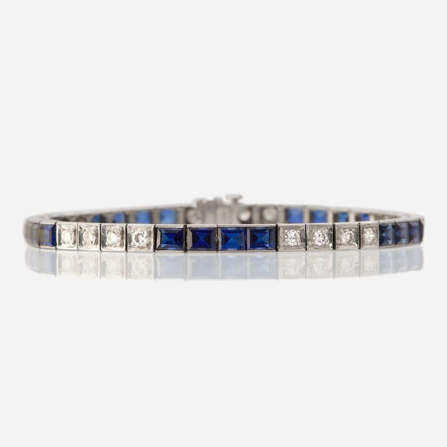 A fourteen karat white gold, synthetic sapphire, and diamond bracelet