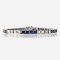 A fourteen karat white gold, synthetic sapphire, and diamond bracelet