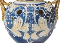 A Wedgwood Parcel Gilt Queensware Twin-Handled Vase and Cover