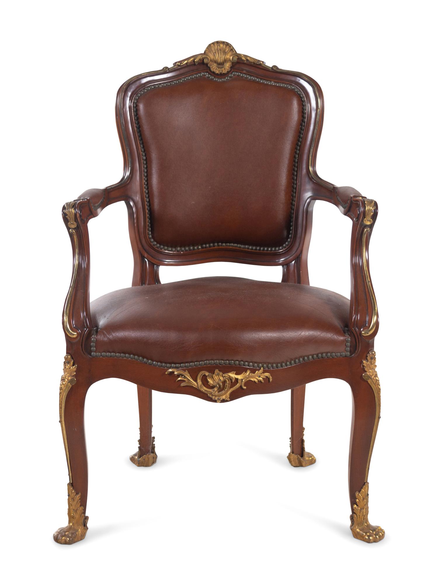 A Set of Fourteen Louis XV Style Gilt Bronze Mounted Walnut Dining Chairs