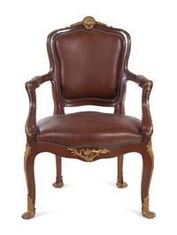 A Set of Fourteen Louis XV Style Gilt Bronze Mounted Walnut Dining Chairs