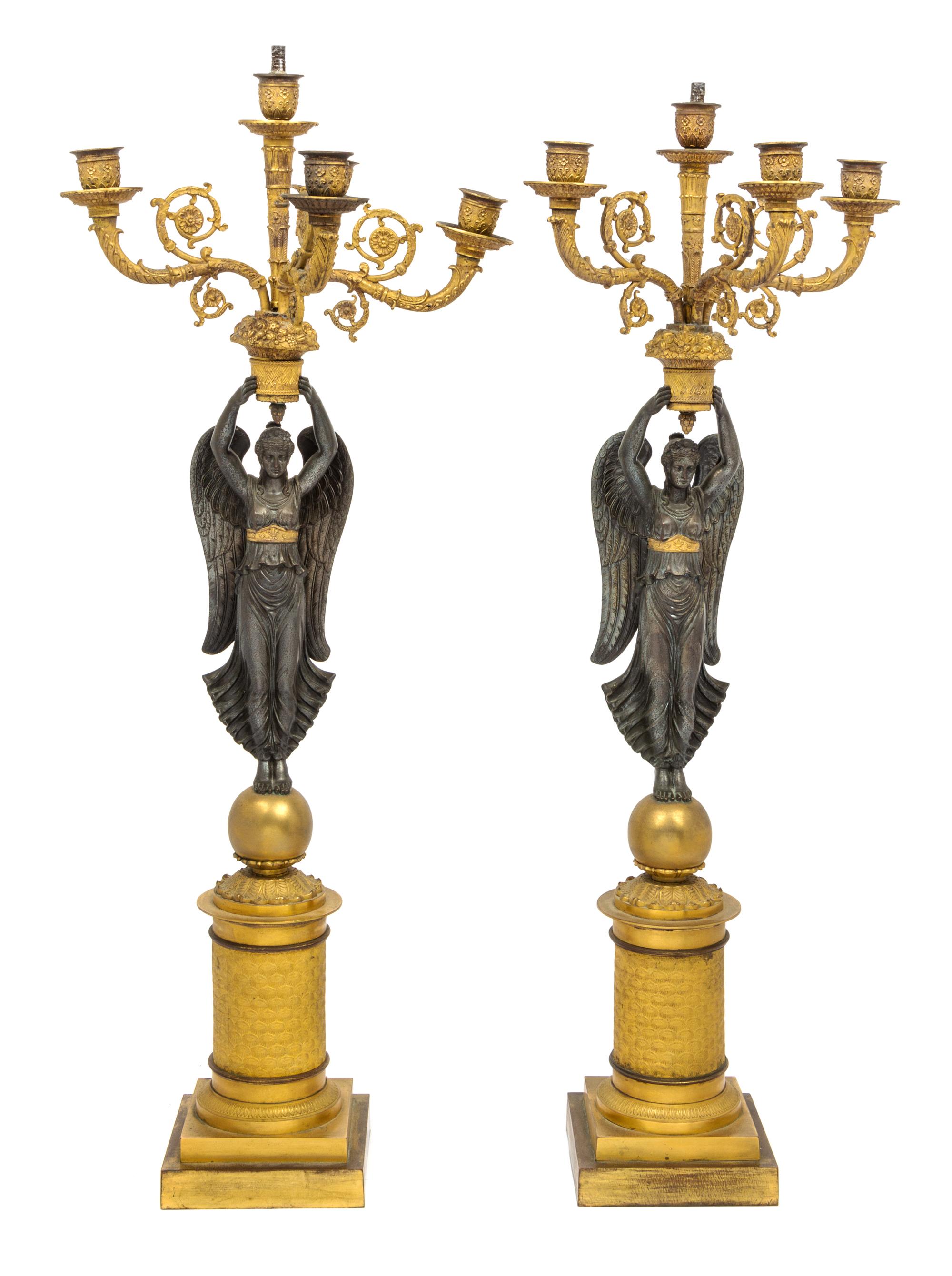 A Pair of Empire Style Gilt and Patinated Metal Figural Five-Light Candelabra Height 29 1/4 inches. — FIRST HALF 19TH CENTURY