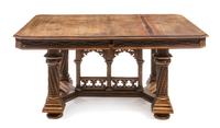 An Italian Gothic Revival Walnut Extension Table, attributed to Victor Aimone, Height 28 1/2 x width 59 1/2 x depth 47 inches (closed).