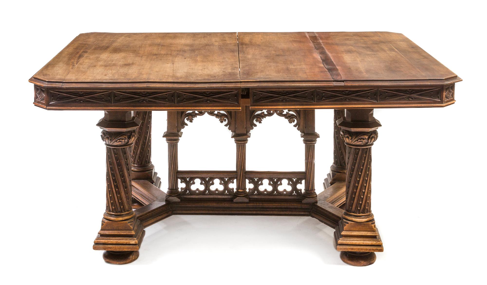 An Italian Gothic Revival Walnut Extension Table, attributed to Victor Aimone, Height 28 1/2 x width 59 1/2 x depth 47 inches (closed).